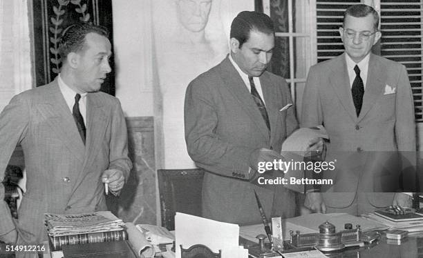 President Fulgencio Batista of Cuba, , is shown as he was about to sign a Declaration of War between Cuba and Germany and Italy, in the Executive...