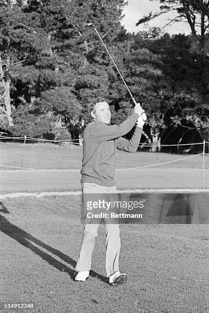 Pebble Beach, CA- Actor Jack Lemmon grins as he belts a good one down the 17th fairway on the Pebble Beach course during a practice round in the Bing...