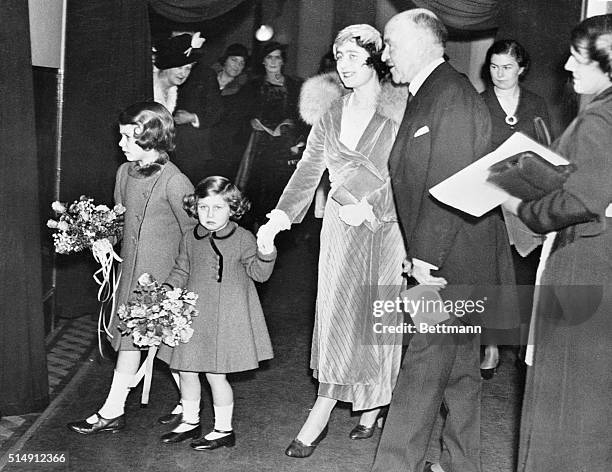 Princess Elizabeth and Princess Margaret Rose, of England, with their mother, the Duchess of York, pictured arriving at the Royal Box at the Albert...