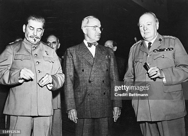 Soviet leader, Joseph Stalin, US President Harry Truman, and British Prime Minister Winston Churchill before starting sessions of their...
