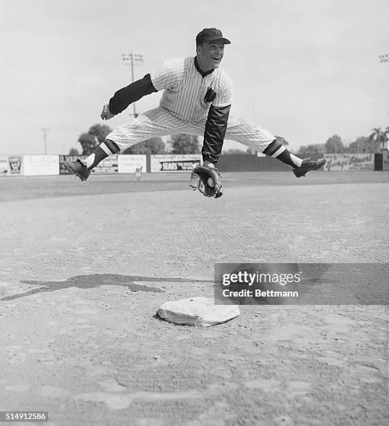 Orlando, Fla.: Although he's not known as a ballet dancer, Washington's Eddie Yost jumps over his third base sack and snags a hoteliner with artistic...