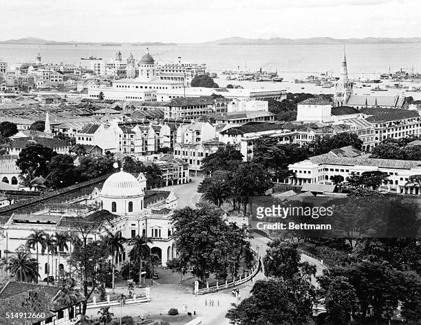 This is is a general view of the harbor and city at Singapore, which may be the next target for Jap bombers, as Nipponese troops landed in Malaya,...