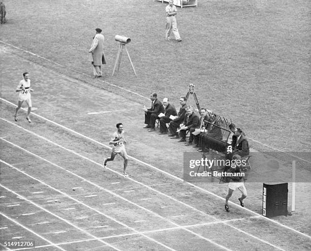 Helsinki: Czech Runner Wins 5,000 Meter event. Emil Zatopek of Czechoslovakia streaks across the finish line to win the 5,000 meter Olympic...