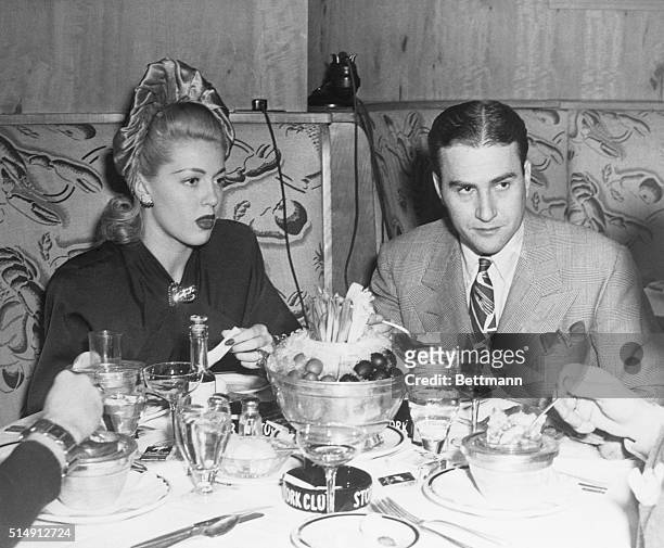Screen star Lana Turner, who secured a divorce from orchestra leader Artie Shaw, are pictured for the 'first time' to-gether again since their...