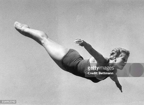 Rome, Italy- Ingrid Kramer of Germany soars through the air during the high diving elimination contest. Miss Kramer was first in the competition and...