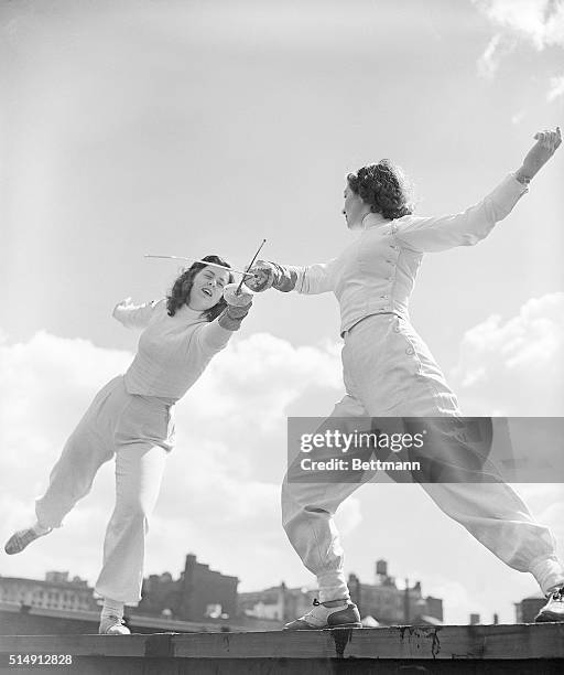 There is vigorous action here as two pretty fencers go all out in a duel -- not against each other, but against the common enemy, fat. There is grace...