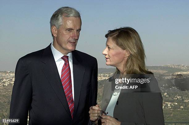 French Foreign Minister Michel Barnier and his wife Isabelle Barnier visit the Yad Vashem Holocaust memorial in Jerusalem 18 October 2004. Barnier is...