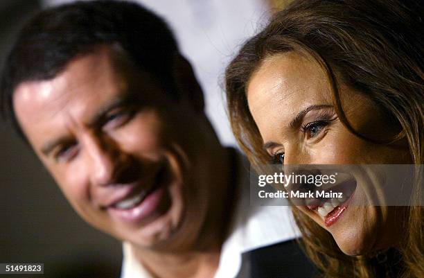 Actors John Travolta and his wife Kelly Preston attend the Hollywood Film Festival's closing night premiere of "A Love Song For Bobby Long" at the...