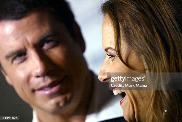 Actors John Travolta and his wife Kelly Preston attend the Hollywood Film Festival's closing night premiere of "A Love Song For Bobby Long" at the...