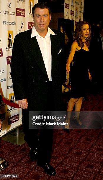 Actor John Travolta and his wife, actress Kelly Preston, attend the Hollywood Film Festival's closing night premiere of "A Love Song For Bobby Long"...