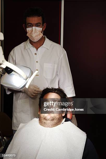 Comedian Johnny Vegas poses at the dentists for a photo call held on December 2, 2003 in London.