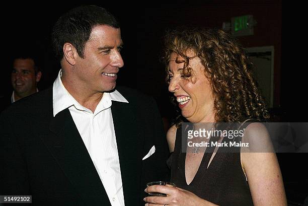 Actor John Travolta and writer/director Shainee Gabel attend the Hollywood Film Festivals closing night premiere after party for "A Love Song For...