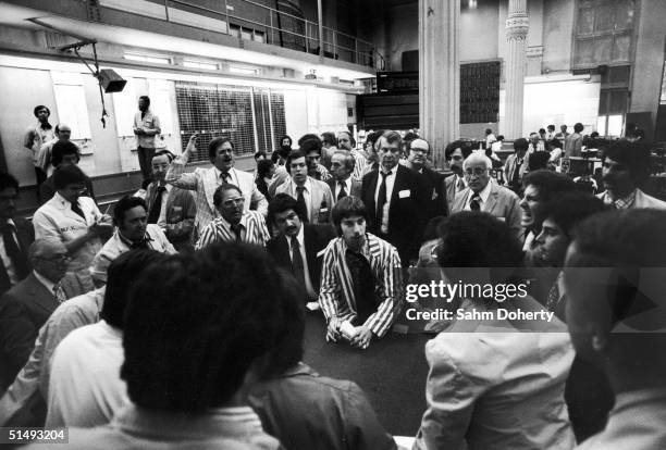 On the floor of the New York Mercantile Exchange, brokers trade on potato futures, New York, New York, May 1976.