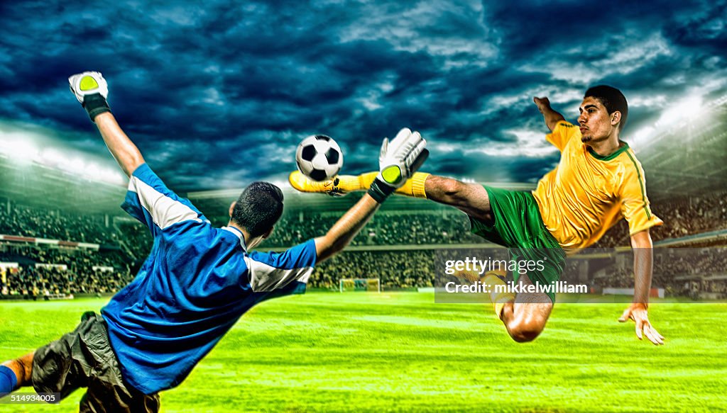 Soccer player kicks football in the air