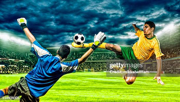 soccer player kicks football in the air - soccer striker stock pictures, royalty-free photos & images