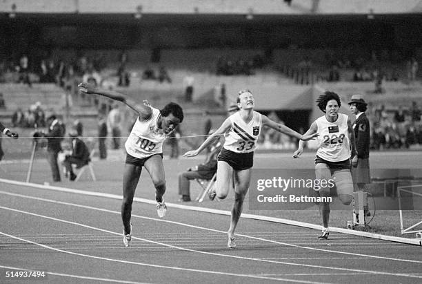 Mexico City, Mexico- Wyomia Tyus of the U.S. Hits the tape to win the finals of the 100-meter dash at the Olympics. Finishing fourth is Raelene Boyle...