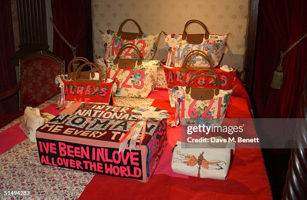 Bags lie on a bed at the Longchamp party to launch bags designed by British artist Tracey Emin, at Portland Place London on October 18, 2004 in...