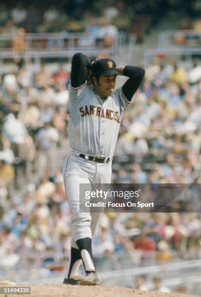 Pitcher Juan Marichal of the San Francisco Giants goes into his windup against the Philadelphia Phillies at Veterans Stadium during the early 1970s...