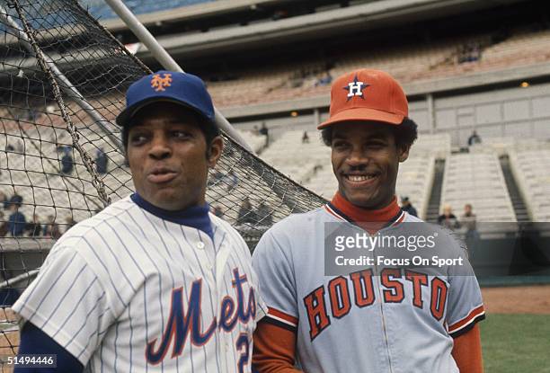 Willie Mays of the New York Mets and Cesar Cedeno of the Houston Astros talk during batting practice at Shea Stadium during the 1972 season in...