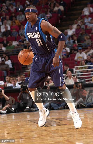 Jason Terry of the Dallas Mavericks dribbles against the Orlando Magic during a preseason game on October 17, 2004 at TD Waterhouse Centre in...