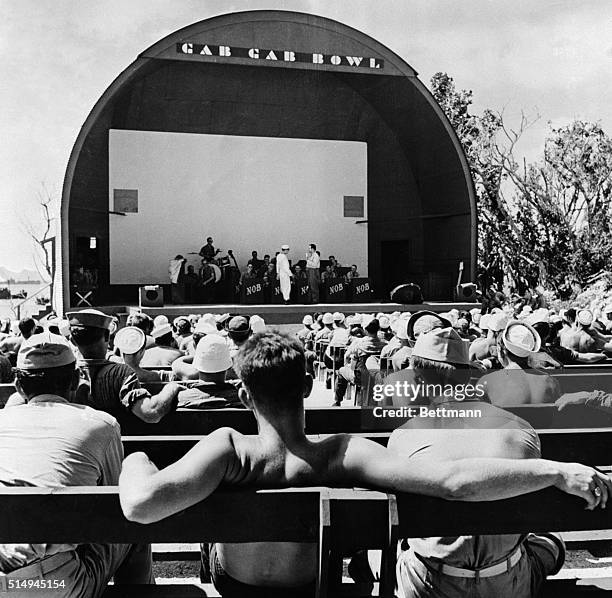 Guam: In the "Gas Gab Bowl," Guam's open air theater, men are entertained by USO troupes and jazz bands.