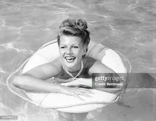 Obviously in top form, Columbia actress, Rita Hayworth, , wife of actor Orson Welles, takes time out from filming of Gilda, to pose for the first...