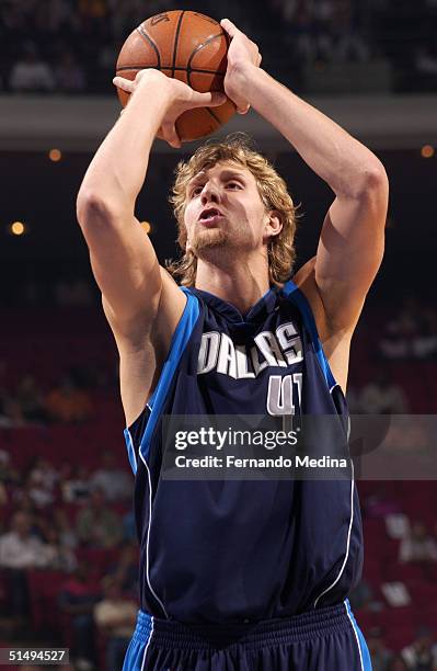 Dirk Nowitzki of the Dallas Mavericks shoots against the Orlando Magic during a preseason game on October 17, 2004 at TD Waterhouse Centre in...