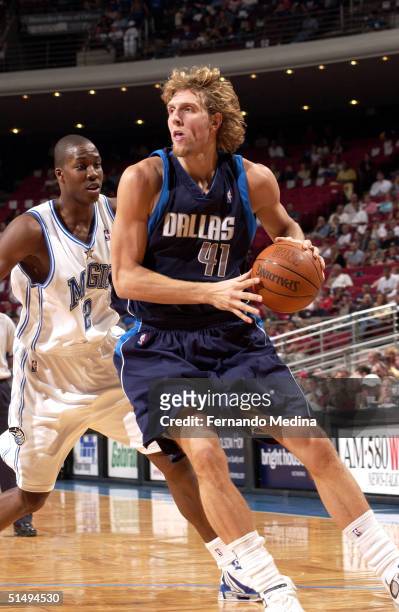 Dirk Nowitzki of the Dallas Mavericks drives to the baseline against the Orlando Magic during a preseason game on October 17, 2004 at TD Waterhouse...