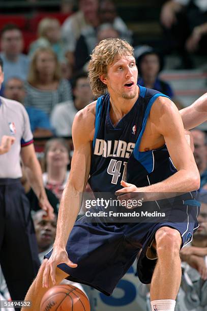 Dirk Nowitzki of the Dallas Mavericks posts up against the Orlando Magic during a preseason game on October 17, 2004 at TD Waterhouse Centre in...