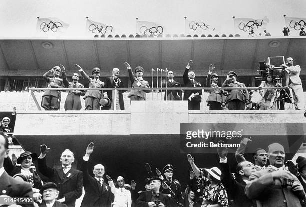 Here is the scene in the Olympic Stadium, Berlin, as Chancellor Adolf Hitler declared the Olympiad officially open. Left to right on the platform...
