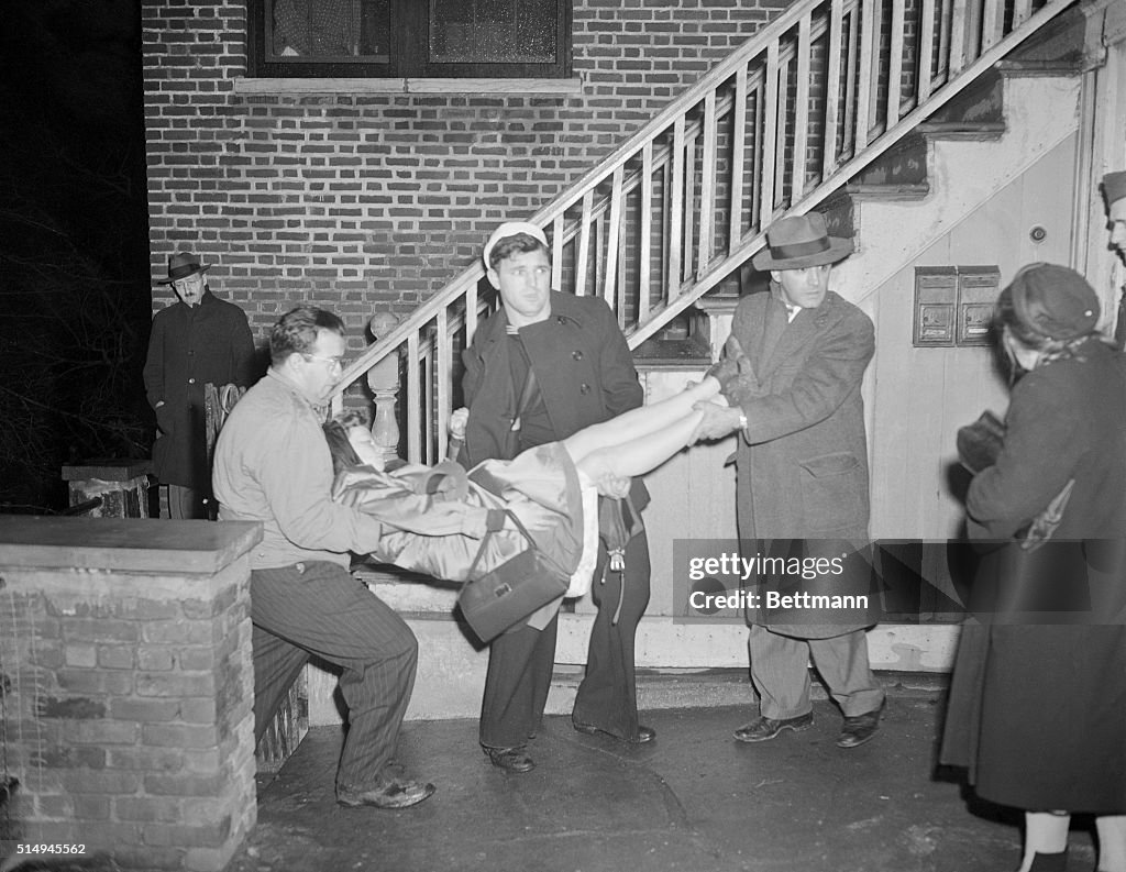 Men Carrying Unconscious Woman