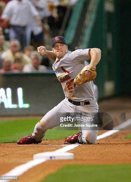 Third baseman Scott Rolen of the St. Louis Cardinals fields a ground ball against the Houston Astros in game five of National League Championship...