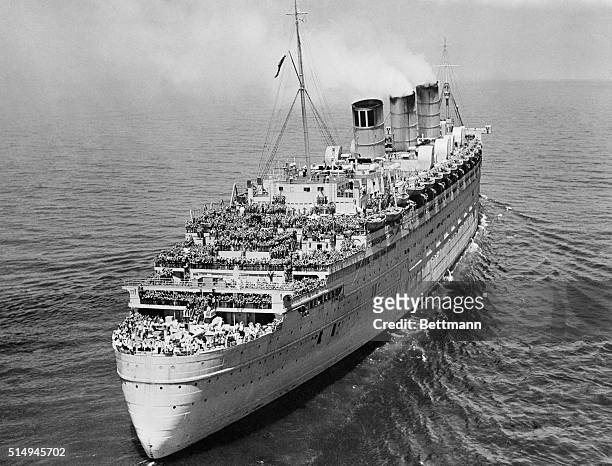The giant British transatlantic liner, Queen Mary, is pictured from a U.S. Coast Guard helicopter as it arrived in New York Bay bringing more than...