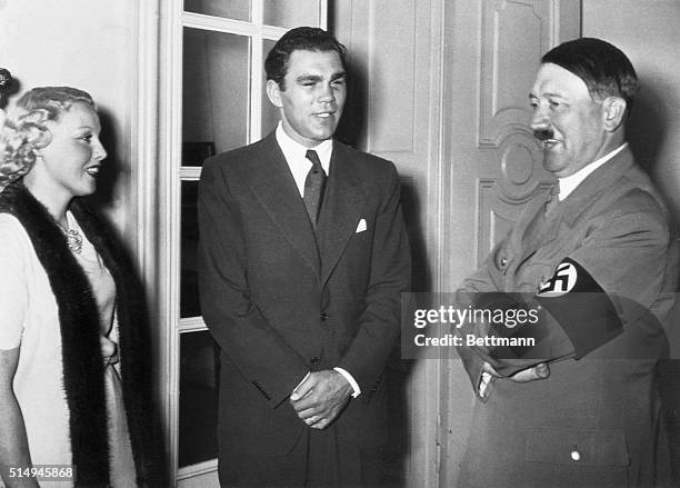 Louis Conqueror Honored by Fuhrer. Berlin, Germany: Max Schmeling, who defeated Joe Louis, boxing sensation, in one of the biggest upsets of...