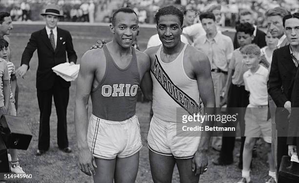 Portrait of Jesse Owens and Ralph Metcalf Standing Arm in Arm.