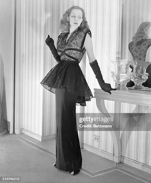 Black chantilly lace bodice and peplum tops the pencil slim skirt of this Miss America Original, designed by Harry Shacter. The black crepe skirt is...