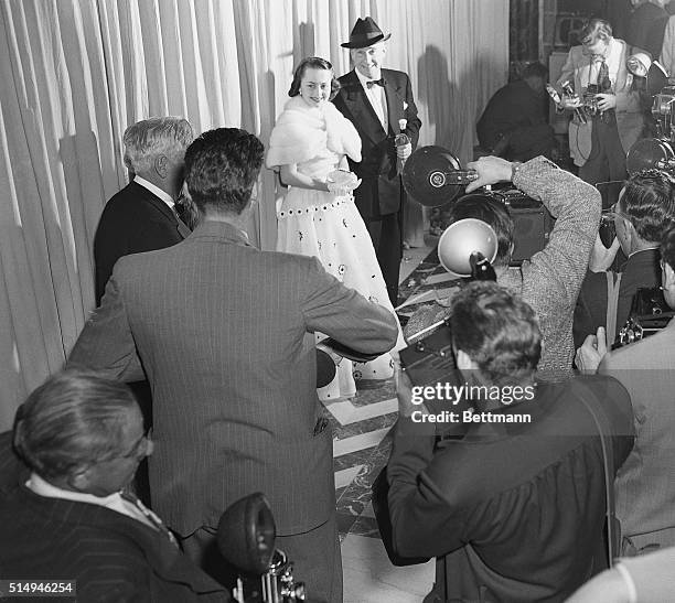 Hollywood, CA- Actress Olivia De Havilland and her husband, author Marcus Goodrich, arrive at a film capital theatre for the annual program of the...