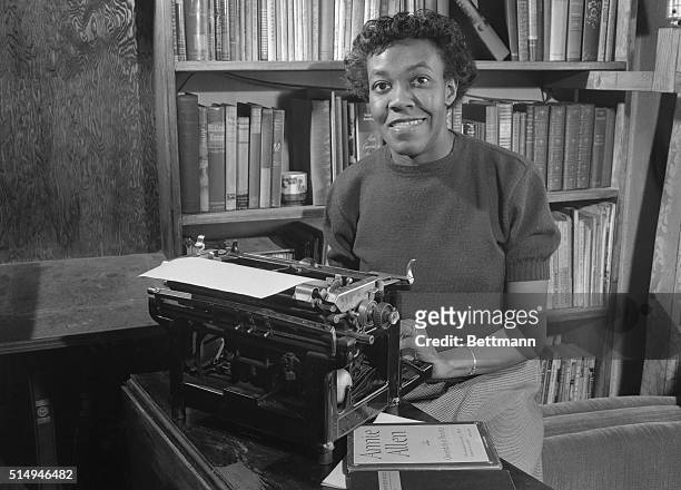 American poet Gwendolyn Brooks sitting at a typewriter at home in Chicago, 2nd May 1950. She has just won the 1950 Pulitzer Prize for poetry, for her...