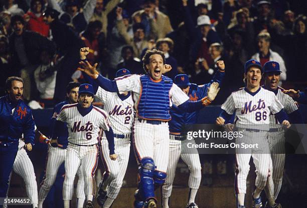 Catcher Gary Carter leads the cheers as the New York Mets start celebrating after defeating the Boston Red Sox in Game Seven of the World Series at...