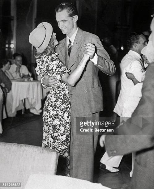 Howard Hughes, millionaire aviator and film producer, dancing with film star Ginger Rogers at the Rainbow Room in New York City.