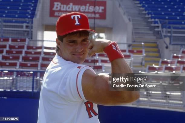 Jose Canseco of the Texas Rangers hams it up for the camera at Charlotte County Stadium on 1994 in Port Charlotte, Florida.
