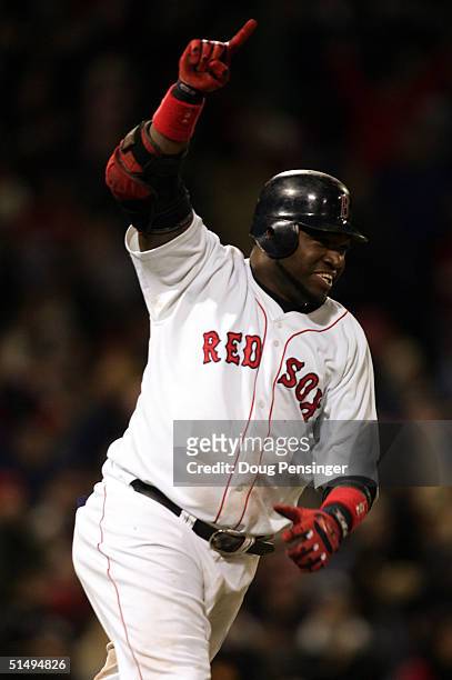 David Ortiz of the Boston Red Sox celebrates after hitting the game winning RBI single in the fourteenth inning to defeat the New York Yankees 5-4...