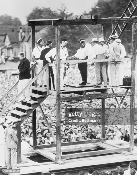 Owensboro, Kentucky: Rainey Bethea, 22-year-old Negro, shown on the gallows, talking to an officer, just before he was hanged in the presence of a...