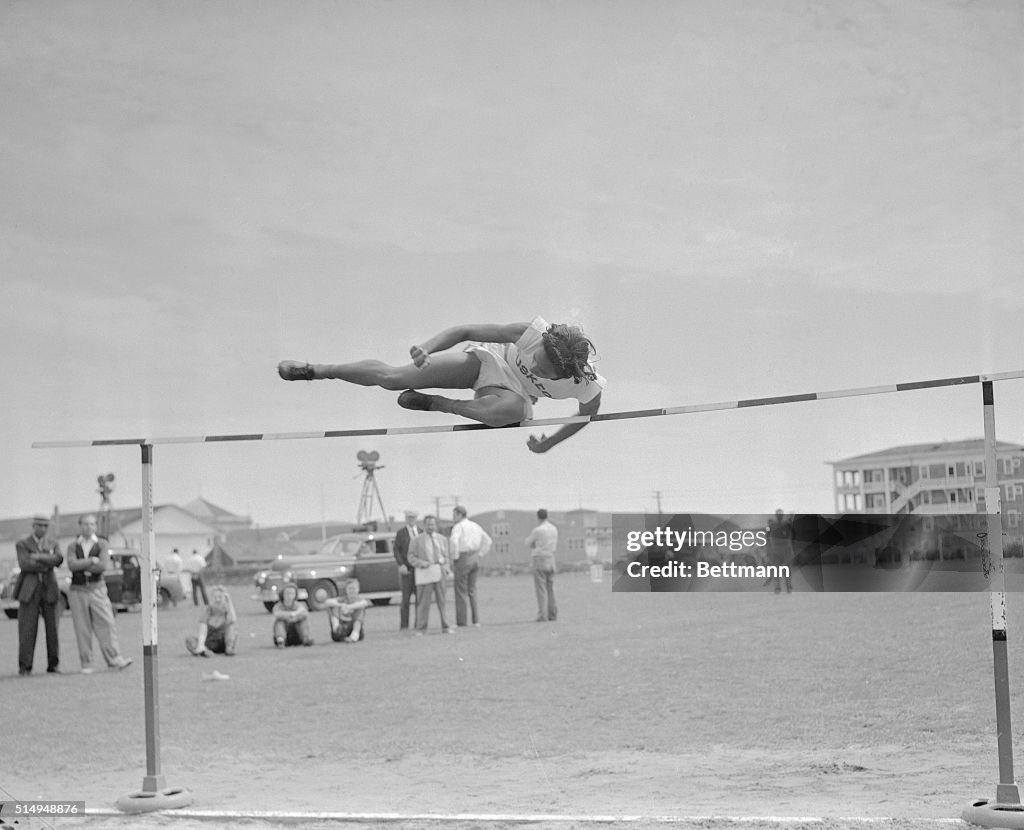 Alice Coachman up and over High Jump Bar