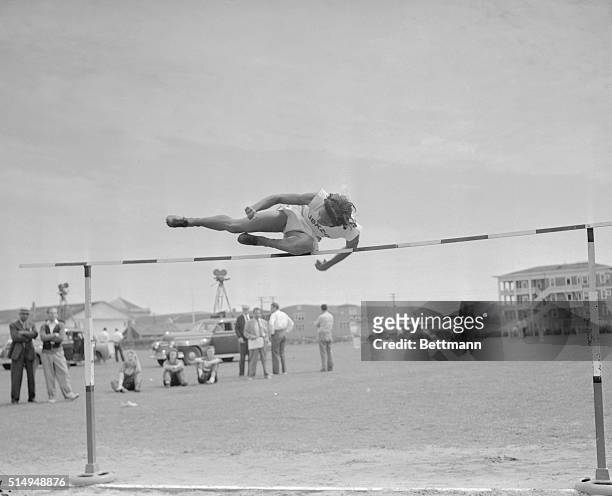 Alice Coachman of Tuskegee, Alabama Institute clears the bar in the running high jump at the Women's National A.A.U. Track and field championships in...