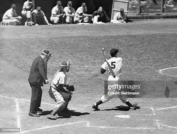 Yankees' Joe DiMaggio swings and misses for a strikeout in the first game's 4th frame at Yankee Stadium, with men on 2nd and 3rd. His was the first...