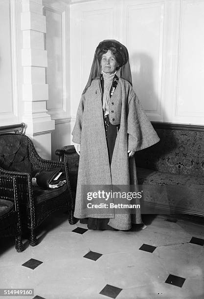 Mrs. Emmeline Pankhurst, the British suffragette, in full length pose wearing a hat and coat. Undated photograph.