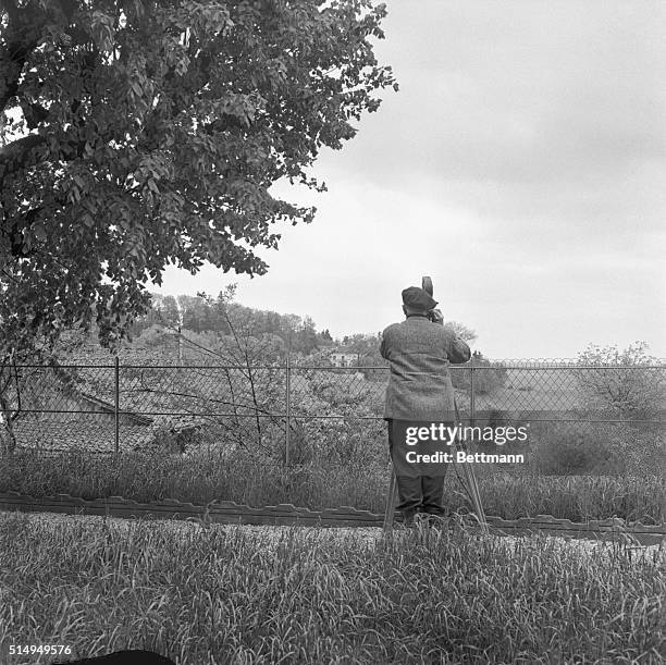 Newsreel cameraman sets his sights on the house of Gen. Charles De Gaulle in this small village in Eastern France. Newsmen have been drawn here in...