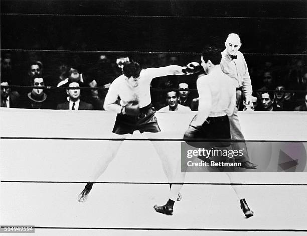 Jimmy Braddock sticks a left jab in Max Baer's face in the first round of their championship fight at Madison Square Garden, June 13, 1935. Braddock,...