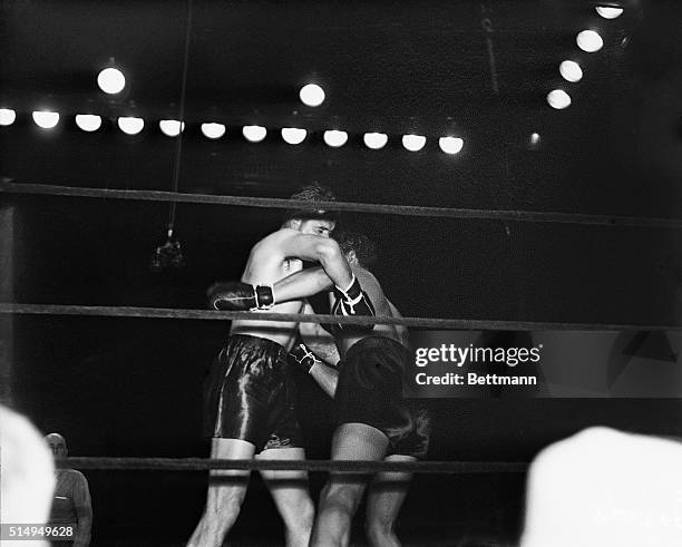 Max Baer and Jimmy Braddock clinch during the fifth round of their championship fight at Madison Square Garden, June 13, 1935. Braddock, the 7-1...